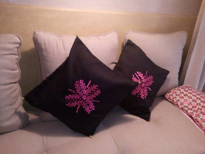 Set of 2 Black Moroccan throw pillows with pink embroidery